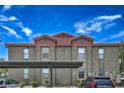 Exterior shot of the condo, showcasing the well-kept building, and dedicated parking spaces at 8000 Badura Ave # 1168, Las Vegas, NV 89113