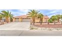 Charming single story home with three-car garage, desert landscaping, and appealing curb appeal at , Pahrump, NV 89061
