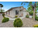 Charming single-story home featuring desert landscaping and a cozy, inviting facade at 10929 Vallerosa St, Las Vegas, NV 89141