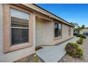 Inviting front entrance with a decorative security door and desert-friendly landscaping, enhancing curb appeal at 10929 Vallerosa St, Las Vegas, NV 89141