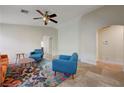 Bright living room featuring neutral walls, a ceiling fan, and tile flooring throughout at 10929 Vallerosa St, Las Vegas, NV 89141