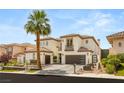 Elegant two-story home with brown roof, complemented by a well-manicured lawn and lush landscaping at 11453 Glowing Sunset Ln, Las Vegas, NV 89135