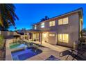 A spacious backyard with a large swimming pool, spa, covered patio, and mature trees at 1721 Sweet Pea Ave, Las Vegas, NV 89183