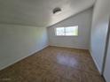 Cozy bedroom with tile flooring and window offering natural light at 1806 Renada Cir, North Las Vegas, NV 89030