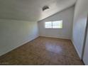 Cozy bedroom with tile flooring and window offering natural light at 1806 Renada Cir, North Las Vegas, NV 89030