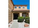Welcoming home entrance featuring double front doors, desert landscaping, and ample natural light at 1904 Imola Ct, Las Vegas, NV 89123