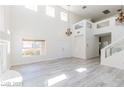 Spacious living room featuring double-door entry and light gray vinyl floors at 1904 Imola Ct, Las Vegas, NV 89123