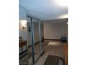 View of the condo entryway featuring mirror sliding door closet and neutral tile flooring at 3111 Bel Air Dr # 6E, Las Vegas, NV 89109