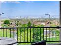 Stunning city views from the private patio of this beautiful residence with wrought iron safety fencing at 350 Gandara St, Las Vegas, NV 89138