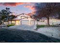 Charming two-story home features a well-maintained front yard and a spacious three-car garage at 4061 W Eldorado Ln, Las Vegas, NV 89139