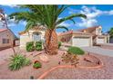 Charming home showcasing desert landscaping and a mature palm tree at 4617 Mancilla St, Las Vegas, NV 89130