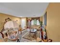 Cozy living room with plush furniture, decorative accents, neutral carpet and tan walls at 5080 Plymouth Bay Ct, Las Vegas, NV 89141