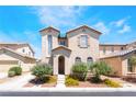 Charming two-story stucco home with a well-maintained front yard and desert landscaping at 5854 Willow Trace Ave, Las Vegas, NV 89139