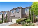 Charming two-story home with desert landscaping in front yard at 6049 Paddleboat St, North Las Vegas, NV 89031