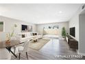 Bright and airy living room with modern furniture and sliding glass doors at 6244 Parsifal Pl, Las Vegas, NV 89107