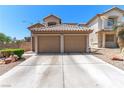 A charming two-story home featuring a spacious two-car garage with a concrete driveway at 7553 Durham Hall Ave # 201, Las Vegas, NV 89130