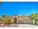 Charming single-story home featuring desert landscaping, an attached garage, and a warm, inviting facade at 8089 Black Orchid Ave, Las Vegas, NV 89131
