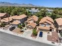 Beautiful neighborhood view featuring well maintained homes and lush desert landscaping at 9520 Rancho Palmas Dr, Las Vegas, NV 89117