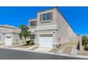 Inviting two-story home featuring a one car garage and xeriscaped front yard at 10078 Delicate Dew St, Las Vegas, NV 89183