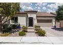 Charming single-story home with a well-manicured front yard and a two-car garage at 12844 New Providence St, Las Vegas, NV 89141