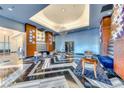 Lobby area with black and white tiled floor, artistic wall decor, and multiple seating areas at 150 Las Vegas Blvd # 2016, North Las Vegas, NV 89101