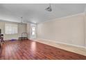 Spacious living room with hardwood floors, bright lighting, and ample space for relaxing and entertaining at 2117 Mountain Rail Dr, North Las Vegas, NV 89084