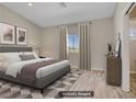 Cozy bedroom with a comfortable bed, neutral decor, and ample natural light at 2130 Revere St, North Las Vegas, NV 89030