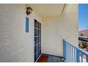 Inviting entryway with a security door and a view of the building's architecture at 2725 S Nellis Blvd # 2036, Las Vegas, NV 89121
