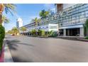 Exterior view of the Palms Place entrance with palm trees and modern architecture at 4381 W Flamingo Rd # 18320, Las Vegas, NV 89103