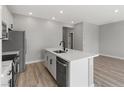 Well-appointed kitchen features stainless steel appliances, a center island with sink, and ample counter space at 4413 Pioche Ave, North Las Vegas, NV 89032