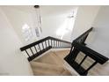 Elegant staircase showcasing modern black railings and bright interior, creating a welcoming space at 4669 Winfield Dr, Las Vegas, NV 89147