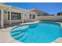 Inviting backyard pool with surrounding concrete patio, ideal for outdoor relaxation and entertainment at 472 Staghorn Pass Ave, Las Vegas, NV 89183