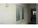 Inviting entryway with white shutters, and a secure door leading into the home at 4821 Black Bear Rd # 104, Las Vegas, NV 89149