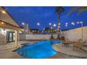 Beautiful backyard featuring a sparkling pool, jacuzzi, and comfortable lounge chairs at 6 Megan Dr, Henderson, NV 89074