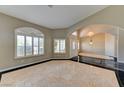 Elegant home foyer featuring high ceilings, marble floors, and arched doorways at 7540 Crystal Cave Dr, Las Vegas, NV 89117