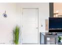 Modern white door with five panels complemented by the interior's clean, minimalist design at 965 Nevada State Dr # 15104, Henderson, NV 89002