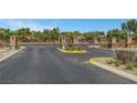 View of community entry gate with stone pillars and decorative metalwork at 10735 Galveston Bay St, Las Vegas, NV 89179
