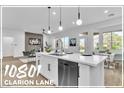 Bright kitchen featuring white cabinets, modern lighting, and stainless steel appliances at 10801 Clarion Ln, Las Vegas, NV 89134