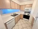 Efficient kitchen includes white appliances, ample countertop space and plenty of cabinet storage at 2064 Mesquite Ln # 102, Laughlin, NV 89029