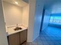 Built-in wet bar area with a stainless steel sink with a view of the city at 2064 Mesquite Ln # 102, Laughlin, NV 89029
