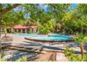 Community pool area with lush greenery and plenty of lounge chairs for relaxing at 2200 S Fort Apache Rd # 2015, Las Vegas, NV 89117