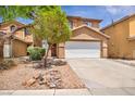 Charming two-story home featuring desert landscaping and a spacious two-car garage at 3232 Brayton Mist Dr, North Las Vegas, NV 89081