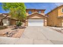 Inviting two-story home with a well-maintained front yard and an attached two-car garage at 3232 Brayton Mist Dr, North Las Vegas, NV 89081