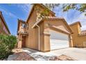 Attractive two-story home with a two-car garage and drought-tolerant landscaping at 3232 Brayton Mist Dr, North Las Vegas, NV 89081