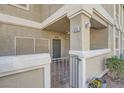 Warm and inviting entrance featuring a gated patio and neutral exterior paint at 3253 Mystic Ridge Ct, Las Vegas, NV 89129