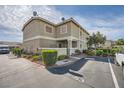Townhouse complex featuring neutral exteriors, well-kept landscaping and ample parking at 3253 Mystic Ridge Ct, Las Vegas, NV 89129