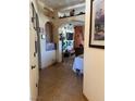View of the foyer leading into the home featuring arched doorways and tile flooring at 3551 Sagebrush Ave, Pahrump, NV 89048