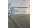 A home with a white garage door and attached garage at 3692 Garden South Dr # 0, Las Vegas, NV 89121