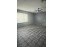 An empty living room showcasing natural light and tile flooring at 3692 Garden South Dr # 0, Las Vegas, NV 89121