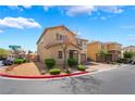 Inviting two-story home with desert landscaping, brick paved driveway, and a two-car garage on a corner lot at 3855 Park Field Dr, Las Vegas, NV 89120